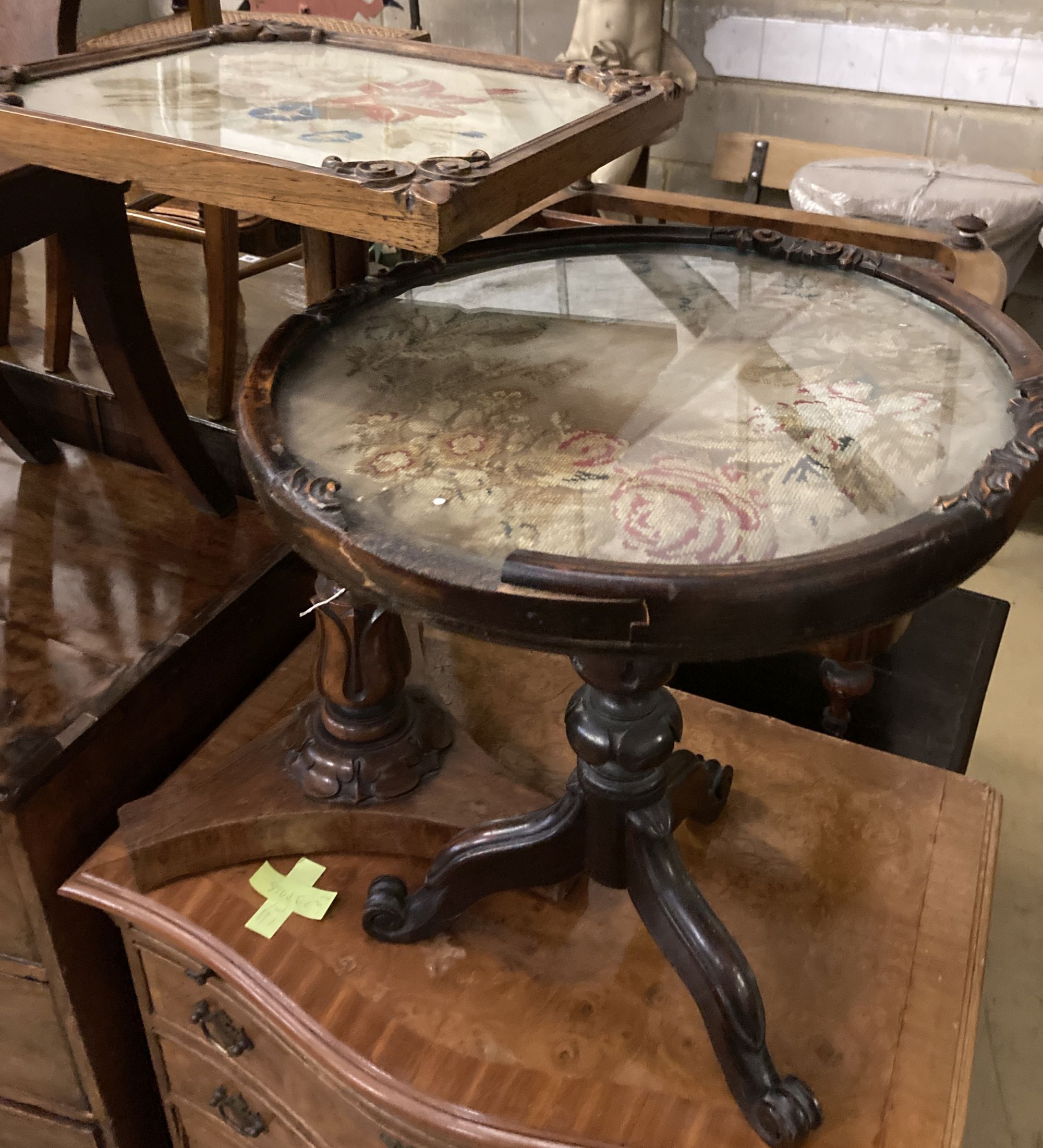 A Victorian rosewood table, with square floral tapestry inset top, over fluted bulbous pillar and triform platform base, height 63cm to